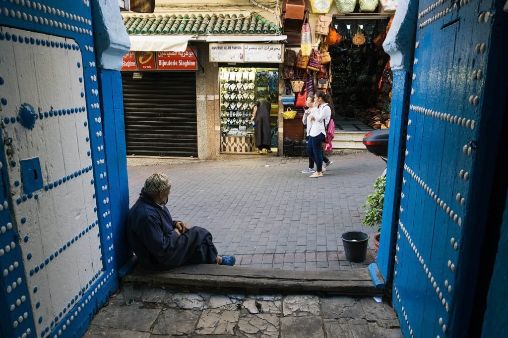 A blue door opening onto a lane in Tangier’s medina