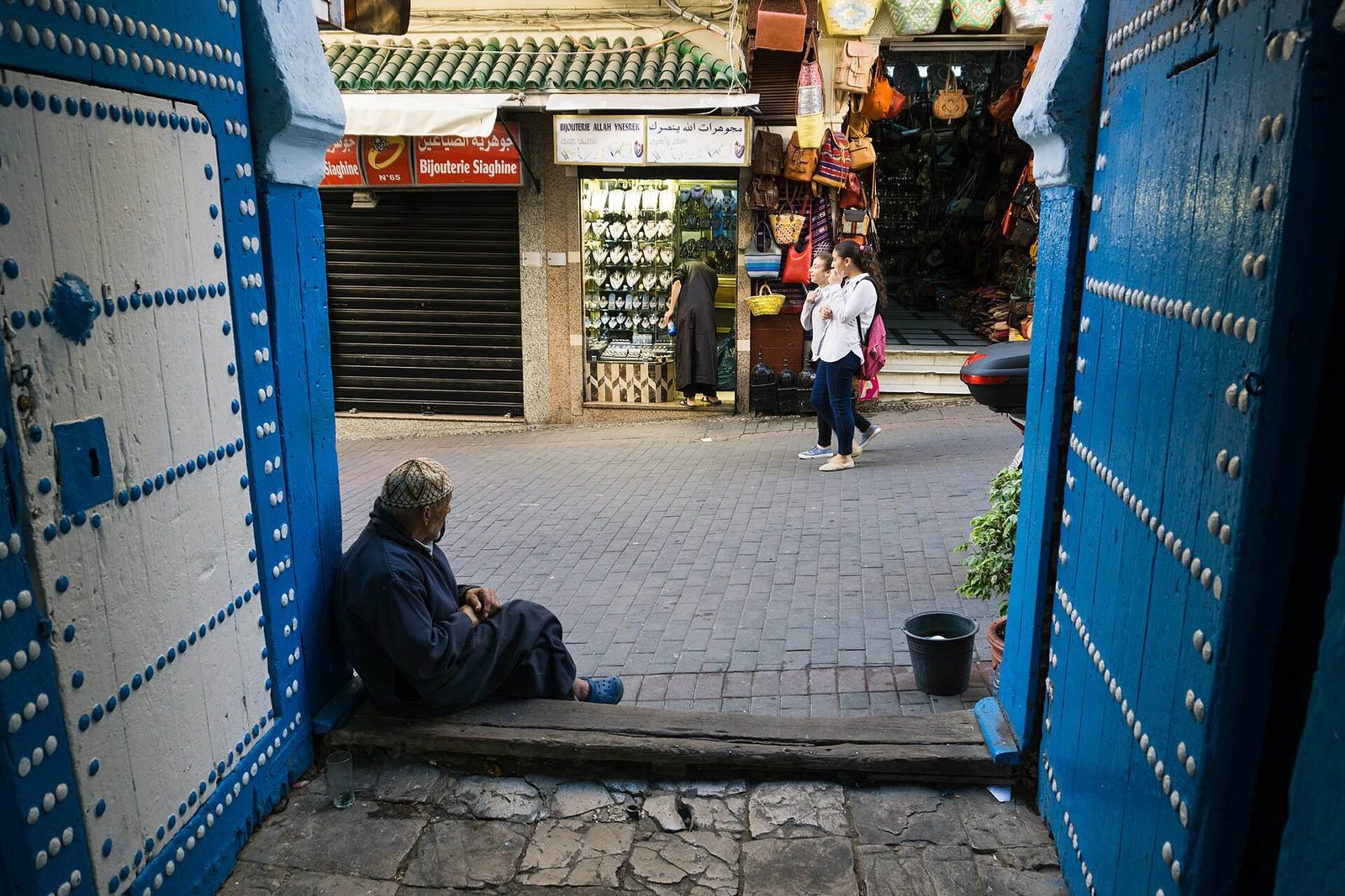 A blue door opening onto a lane in Tangier’s medina