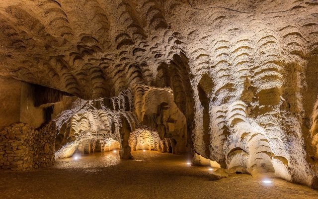 The scalloped rock walls inside the Caves of Hercules