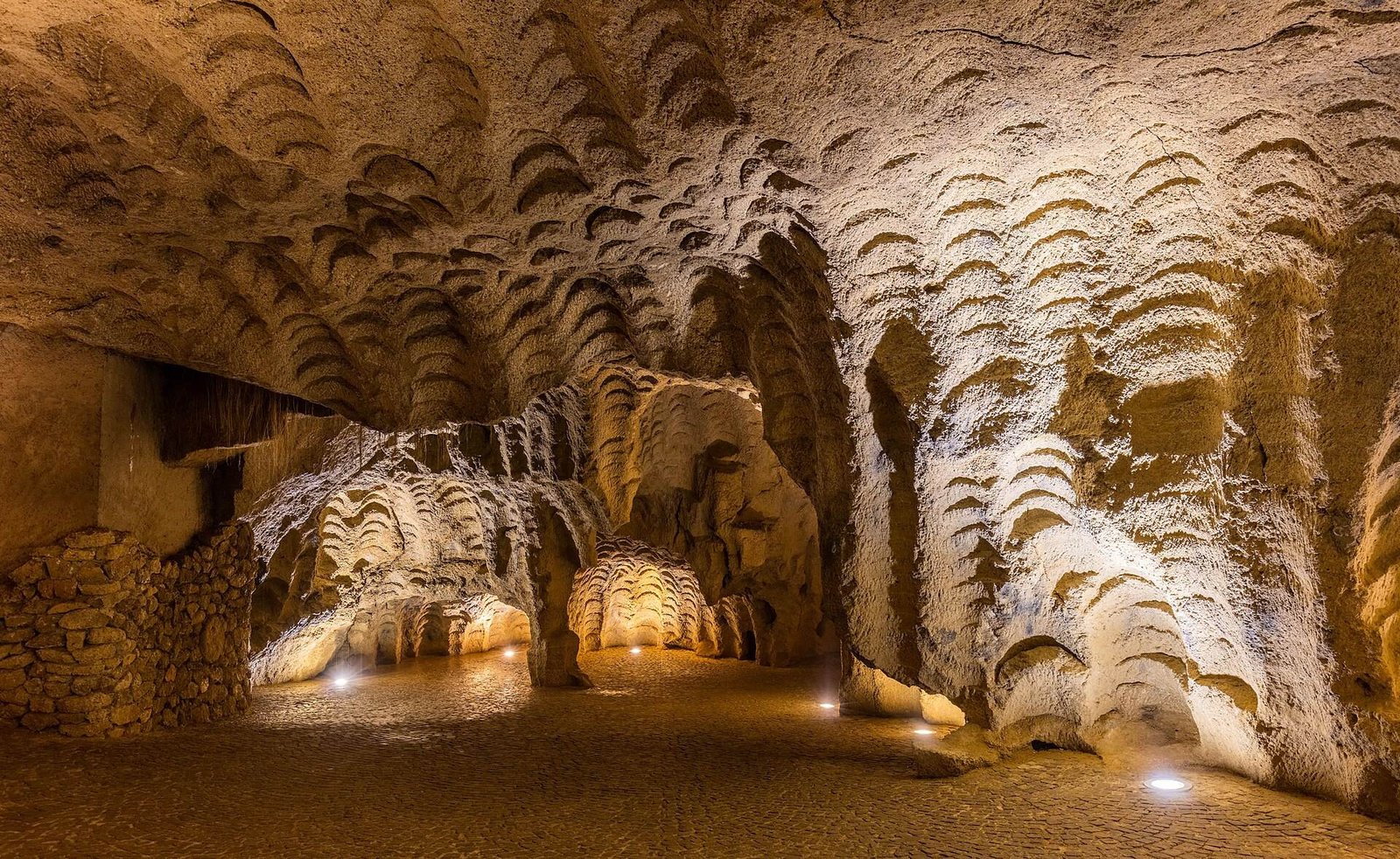 The scalloped rock walls inside the Caves of Hercules