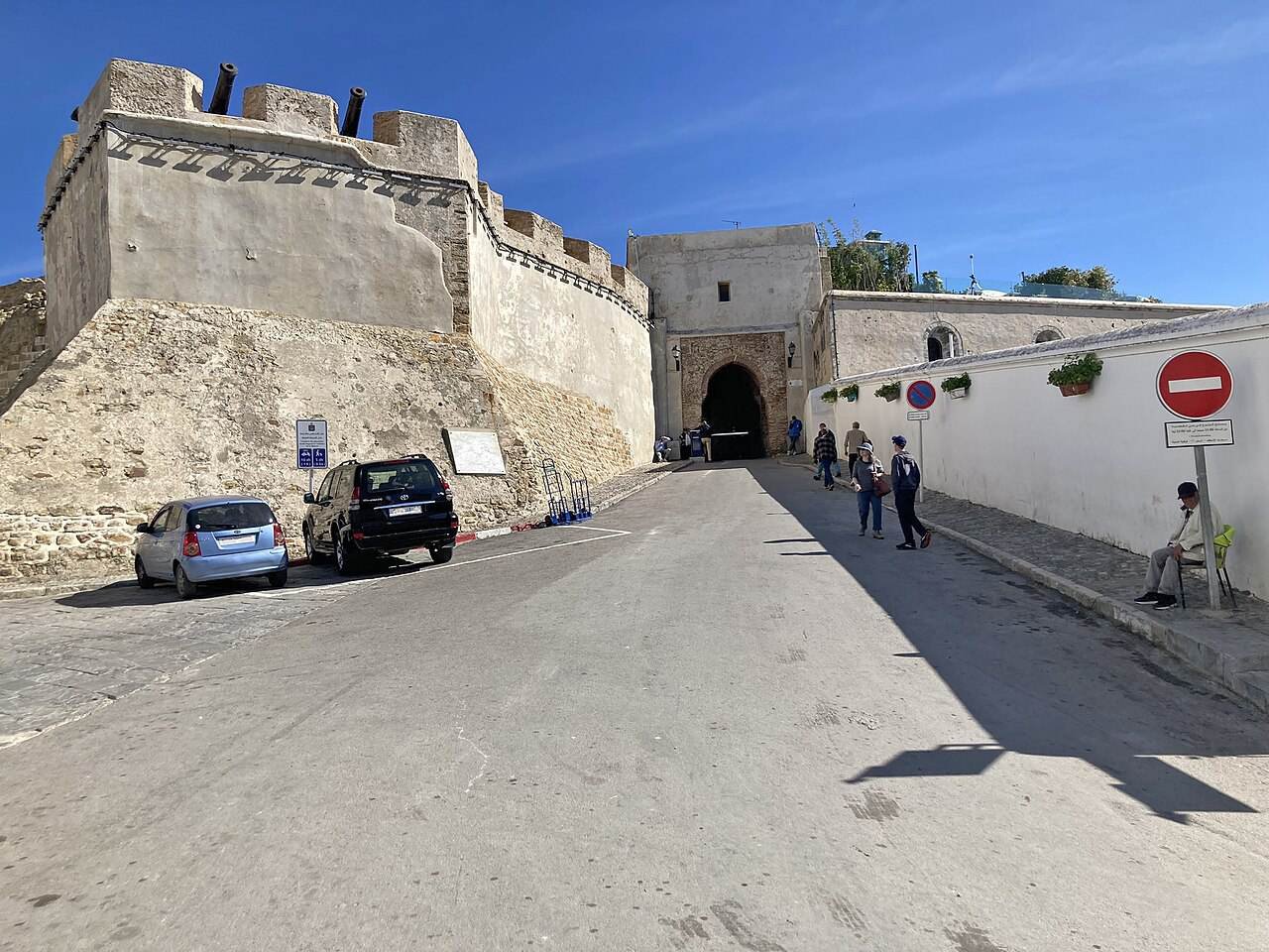 Bab Kasbah gate and the walls of the Kasbah under a blue sky