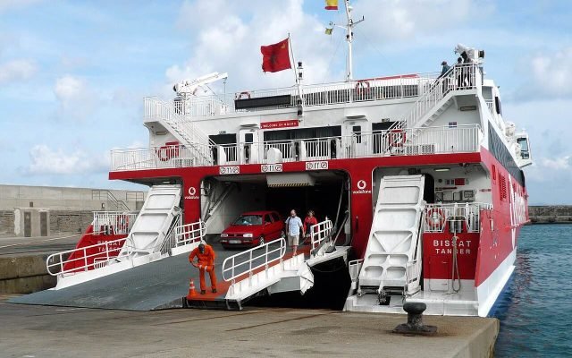 A fast ferry in port with its car ramp lowered