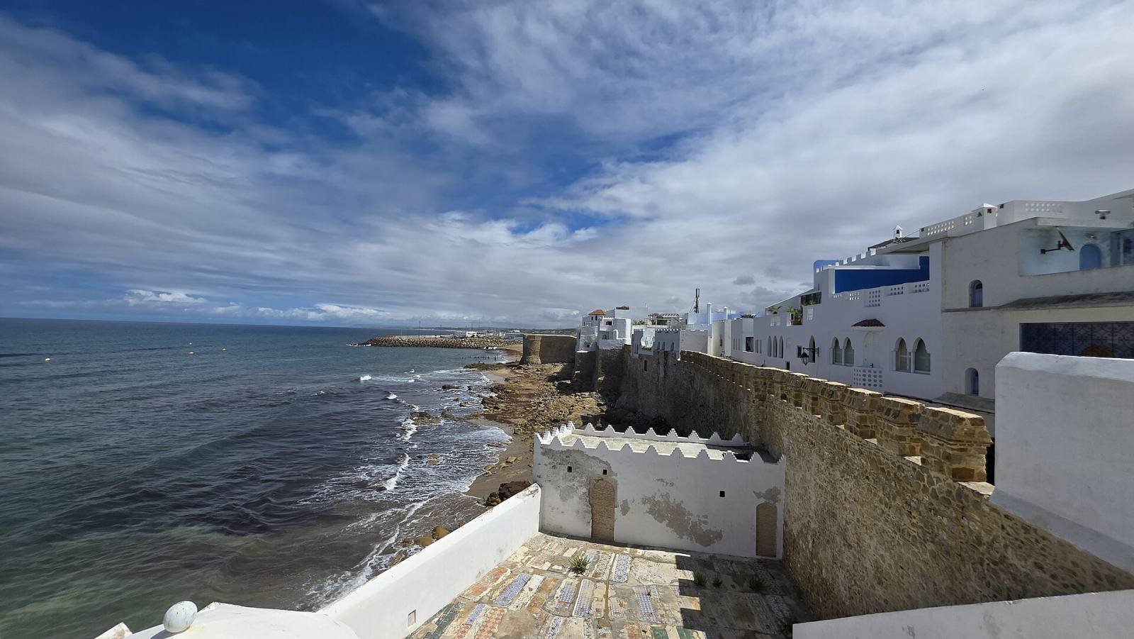The old stone ramparts of Asilah’s medina beside the Atlantic Ocean