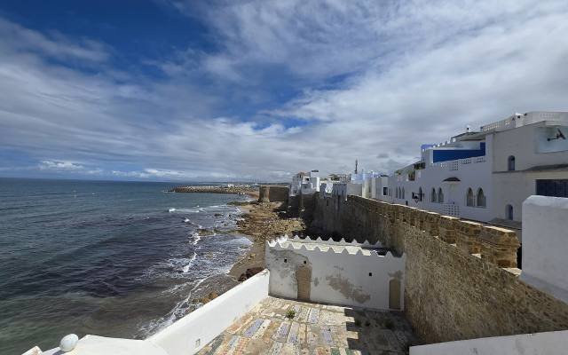The old stone ramparts of Asilah’s medina beside the Atlantic Ocean