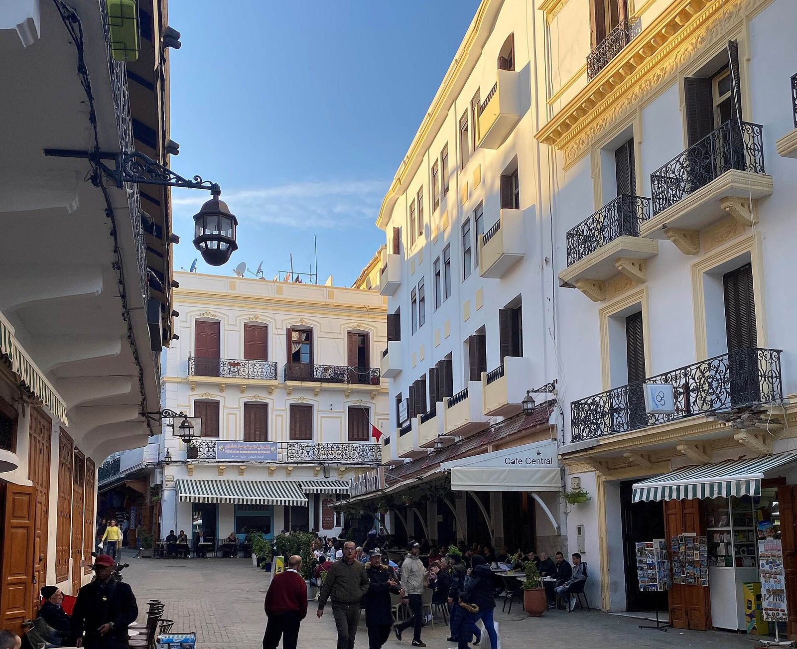 Cafés and white buildings with wrought-iron balconies around the Petit Socco